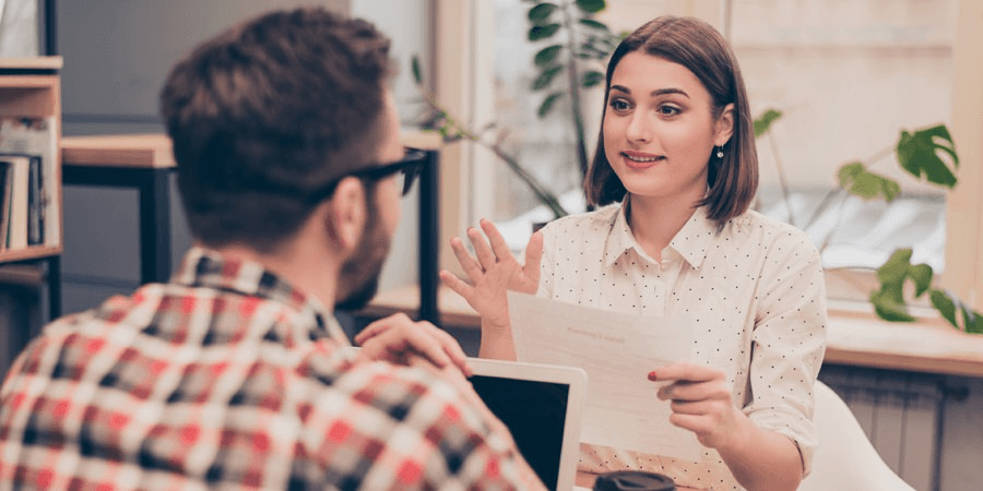 Woman giving training to her team member